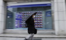 Акциите в Азия продължават седмичната загуба, фючърсите в САЩ се понижават