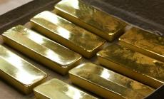 Златото отстъпва, след като ФЕД видя възстановяване на американската икономика