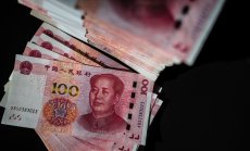 Най-големият отлив на капитали от Китай от години засилва натиска върху юана
