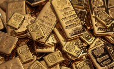 Златото се покачва с посланието на Фед и колебанията на йената