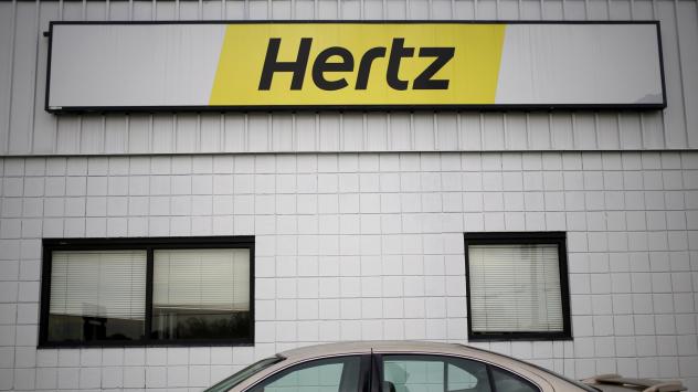 Логото на Hertz - най-голямата компания за отдаване на коли под наем. Снимка: Luke Sharrett/Bloomberg