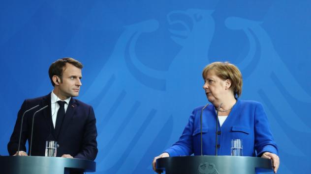 Германският канцлер Ангела Меркел и френският президент Еманюел Макрон. Снимка: Krisztian Bocsi/Bloomberg