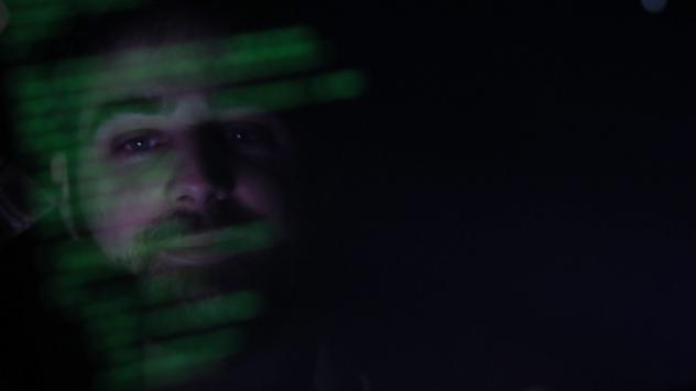 Лицето на участник в TechCrunch Disrupt Лондон 2015 се отразява на екрана на лаптоп. Photographer: Luke MacGregor/Bloomber